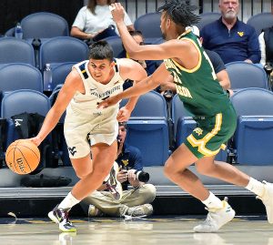 WVU forward Akok Akok rushed to hospital during WVU exhibition victory against George Mason